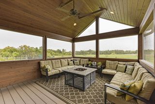 Screened in porch with maintenance free decking, ceiling fan, recessed lighting