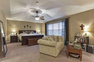 Huge master bedroom with trey ceiling and ceiling fan. Large Walk-in closet