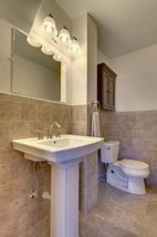 Tiled floors and transitional fixtures.