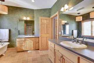 Owners bath with double sinks and stand alone shower and tub