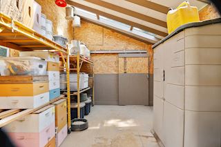 Workshop with barn door leading to chicken coop