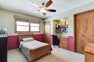 Bedroom 2 upstairs with ceiling fan, 2 closets and built in desk area