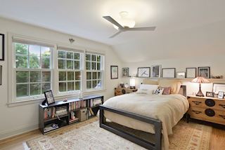 Second floor offers two treetop bedrooms and a shared sitting area, full bath and lots of kneewall storage