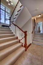 Stairs leading to second level. Private stair to owners suite. Large Marvin windows bring in natural light.