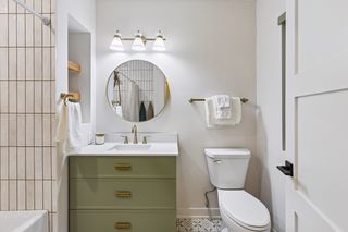 Your main bath is just as nice as the primary with gorgeous, custom tile work and the same stylish look you'll become used to in the rest of your home