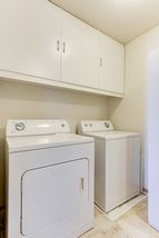 Laundry room upstairs across the hall from full bath