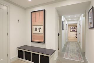 Lower level includes lots of closets, entry into the tuckunder oversized two car garage and hallway to laundry room, full bath, sauna, exercise room and wine cellar