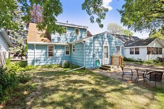 Backyard has gathering spot with lawn and patio