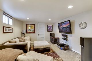family room lower level with newer carpeting, recessed lighting