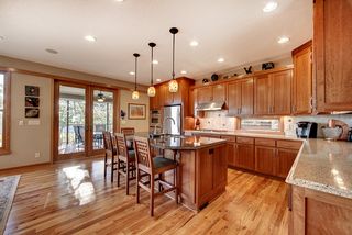Fabulous red oak floors, complement the custom built, cherry craftsmen style cabinetry.