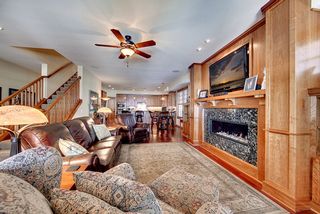 Highlights the open feel of the Great Room, Dining space and Kitchen.