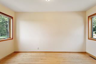 First floor bedroom is light & bright