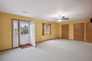 Huge 22.5 x 14.5 basement family room with walkout to paver patio in backyard