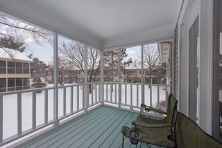 Fully Screened in porch overlooking back courtyard and green space