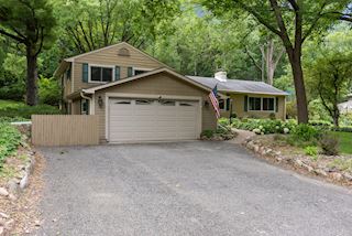 Oversized two car garage with storage and extra parking space on the driveway