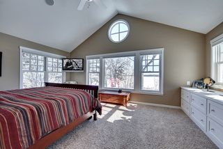 Spectacular Master Bedroom with painted millwork and painted custom cabinetry.