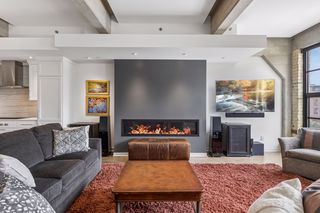 The living room features a wide gas fireplace.