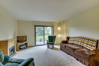 Open, light, and bright living room with slider opening to patio...