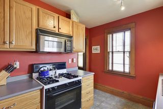 Kitchen with gas stove and built in microwave. 