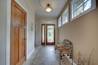 Tile entry with leaded glass door and sidelights.