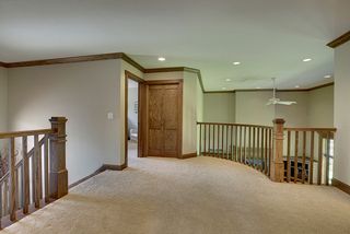 Open upper hallway overlooking Great Room, spacious, natural light.