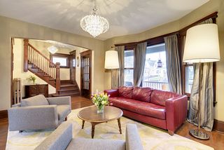 Entertain in style! You will enjoy the Light-Filled Living Room with Crystal Chandelier...