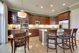 The layout provides three eating in areas: dining room, breakfast bar, and eat-in area.