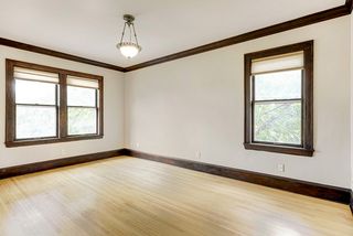 Period light fixture, hardwood floors throughout.