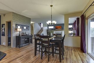 past the accent wall is the main floor powder room, mudroom and 3 car garage