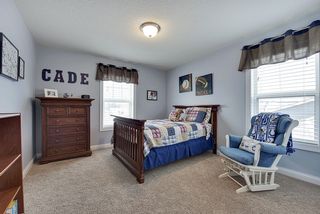 Note the spacious bedrooms on this level. Shown with full size bed, but plenty of space for king or double twins in this room.