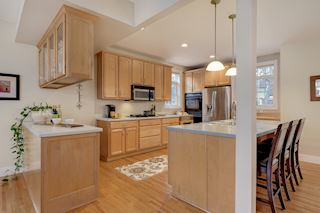 Kitchen offer gas cooktop, wine refrigerator and large island for guests to gather while you prepare meals.