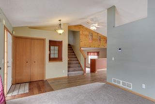 A view of the entry and stairway leading up to the bedrooms