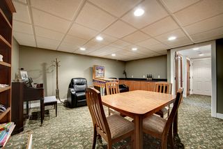 Game/theatre area looking to garage entry and additional storage