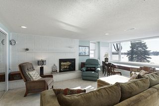 Lower lever living room with fireplace and stunning views