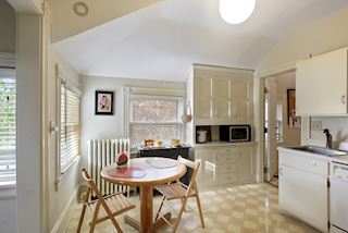 Eat in Kitchen space and wonderful storage awash in light from corner windows