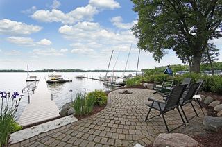 Tastefully landscaped paver patio with gas fire pit