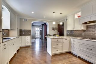 The Custom Designed Kitchen features High-End Delicatus White Granite