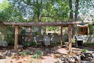 Pergola offers summer dining and barbeque gathering spot