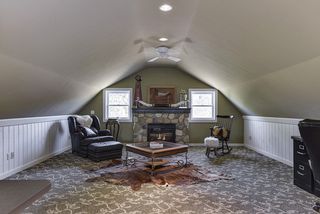 Gorgeous bonus room above the barn features gas fireplace