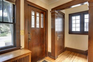 Oversized moldings and stained wood work greet guests as they arrive