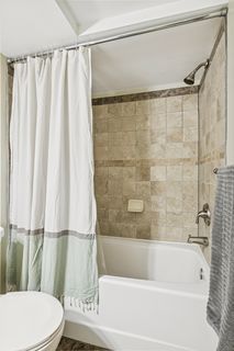 24. Lower level bathroom has a large tub and shower