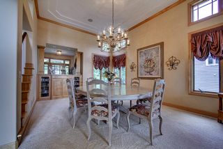 Large gathering space for dining, maple built - ins with a racetrack style smooth ceiling.
