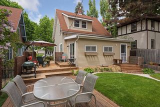 Fabulous newly landscaped back and side yard with patio, deck and newly sodded lawn 