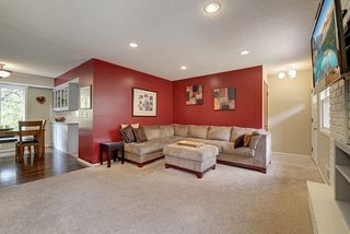 Living room situated off of dining/kitchen area