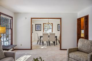 Living room leads to formal dining room.
