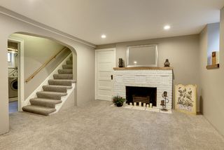 Amazing! The Newly finished Lower Level features a Decorative Fireplace, Recessed Lights and NEW Daylight Windows...