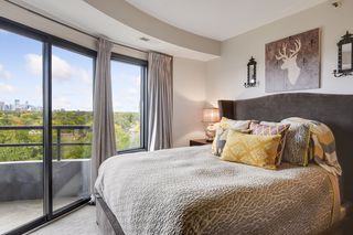 OWNER'S BEDROOM WITH SKYLINE VIEW & PRIVATE BALCONY