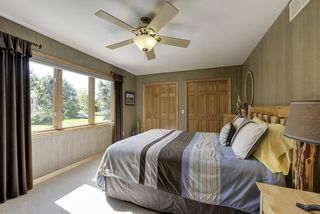 Bedroom 4 overlooks the front yard and driveway with double closets