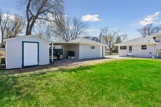 Detached garage with carport behind