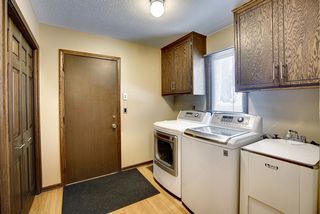 Laundry, mudroom, and tons of storage with access to the garage